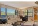 Cozy living room with large windows and a comfortable seating area, plus view at 8779 Midnight Pass Rd # 106H, Sarasota, FL 34242