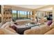 Bright living room with a large window, comfortable seating, and built-in features at 8779 Midnight Pass Rd # 106H, Sarasota, FL 34242