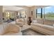 Inviting living room with comfortable seating and picturesque views at 8779 Midnight Pass Rd # 106H, Sarasota, FL 34242