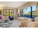 Bright living area with window seat and scenic neighborhood views at 8779 Midnight Pass Rd # 106H, Sarasota, FL 34242
