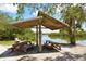 This shady picnic spot provides waterfront views, offering the perfect spot to relax with nature at 8779 Midnight Pass Rd # 106H, Sarasota, FL 34242