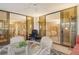 Cozy sunroom with seating area offering views of the dining room and bedroom at 8779 Midnight Pass Rd # 106H, Sarasota, FL 34242