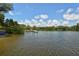 Scenic waterfront view featuring docks and lush green surroundings at 8779 Midnight Pass Rd # 106H, Sarasota, FL 34242