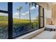 Serene neighborhood views from a window with a cozy seat at 8779 Midnight Pass Rd # 106H, Sarasota, FL 34242