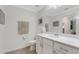 All-white bathroom featuring a spacious countertop and ample storage at 910 Tidewater Shores Loop # 107, Bradenton, FL 34208