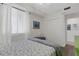 Bright bedroom with a cozy bed, closet, and a window at 910 Tidewater Shores Loop # 107, Bradenton, FL 34208