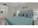 Bright bedroom featuring a comfortable bed and stylish nautical themed decor at 910 Tidewater Shores Loop # 107, Bradenton, FL 34208