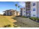 The building's exterior features lush landscaping and balconies at 910 Tidewater Shores Loop # 107, Bradenton, FL 34208