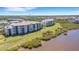 Waterfront condos feature spacious balconies and lush green surroundings by the water at 910 Tidewater Shores Loop # 107, Bradenton, FL 34208