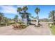Gated community entrance with lush landscaping and secure access for residents at 910 Tidewater Shores Loop # 107, Bradenton, FL 34208
