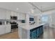 Bright kitchen with quartz countertops, white cabinets, stainless steel appliances, and breakfast nook at 910 Tidewater Shores Loop # 107, Bradenton, FL 34208