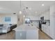 Bright kitchen with quartz countertops, white cabinets, and stainless steel appliances at 910 Tidewater Shores Loop # 107, Bradenton, FL 34208