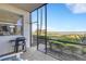 The screened-in porch features beautiful views, brick pavers, and a grill for outdoor cooking at 910 Tidewater Shores Loop # 107, Bradenton, FL 34208
