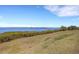 Scenic water view with green landscape in the foreground at 910 Tidewater Shores Loop # 107, Bradenton, FL 34208