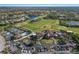 An aerial shot captures the beautiful landscaping, surrounding community, and various recreational facilities at 9408 Glen Abbey Ln, Sarasota, FL 34238