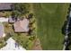 Aerial view showing a home next to golf course, lush landscaping, and serene surroundings at 9408 Glen Abbey Ln, Sarasota, FL 34238