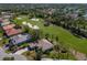 Enjoy scenic views of the golf course and lush greenery in this aerial view of the property at 9408 Glen Abbey Ln, Sarasota, FL 34238
