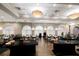 Elegant ballroom with neutral colors, tray ceiling, and arch windows, great for events and celebrations at 9408 Glen Abbey Ln, Sarasota, FL 34238