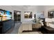 Inviting bedroom with a king bed, TV, and a view of palm trees and a sunset, creating a relaxing ambiance at 9408 Glen Abbey Ln, Sarasota, FL 34238