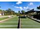 Inviting bocce ball court surrounded by lush greenery, perfect for outdoor recreation and friendly competition at 9408 Glen Abbey Ln, Sarasota, FL 34238