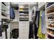 Spacious walk-in closet with ample storage solutions, including shelves, drawers, and hanging rods at 9408 Glen Abbey Ln, Sarasota, FL 34238