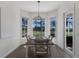 Cozy dining area with ample natural light and views of the backyard at 9408 Glen Abbey Ln, Sarasota, FL 34238