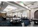 Elegant dining room with ample seating, decorative lighting, and a lovely ambiance at 9408 Glen Abbey Ln, Sarasota, FL 34238