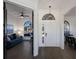 Inviting foyer with natural light, chandelier, views of the office, and dining room at 9408 Glen Abbey Ln, Sarasota, FL 34238