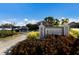 Exterior view of the Health & Fitness Center sign in a well-landscaped community at 9408 Glen Abbey Ln, Sarasota, FL 34238