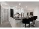 Bright kitchen featuring stainless steel appliances, a breakfast bar, and ample cabinet space at 9408 Glen Abbey Ln, Sarasota, FL 34238