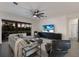 Living room featuring modern furniture and a large sliding glass door overlooking the backyard at 9408 Glen Abbey Ln, Sarasota, FL 34238