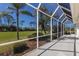 The screened-in lanai shows the beauty and comfort of outdoor living at 9408 Glen Abbey Ln, Sarasota, FL 34238