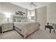 Cozy bedroom with neutral tones, a comfortable bed, and stylish furnishings for a relaxing retreat at 9928 Bright Water Dr, Englewood, FL 34223