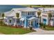 Beautiful clubhouse exterior featuring coastal design elements and lush landscaping at 9928 Bright Water Dr, Englewood, FL 34223