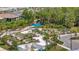 Aerial view of a community garden with raised garden beds and mature trees at 9928 Bright Water Dr, Englewood, FL 34223