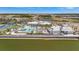 Beautiful community pool and amenity center with palm trees, beach, and lake views at 9928 Bright Water Dr, Englewood, FL 34223