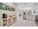 Bright kitchen featuring white cabinets, stainless steel appliances, and tile flooring at 9928 Bright Water Dr, Englewood, FL 34223
