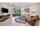 Comfortable living room with stylish furnishings, decor, and outdoor access at 9928 Bright Water Dr, Englewood, FL 34223