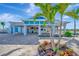 Brand new outdoor bar and grill featuring a seating area, tile details, and blue accents at 9928 Bright Water Dr, Englewood, FL 34223