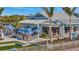 Outdoor view of the community restaurant offering patio seating and inviting landscaping details at 9928 Bright Water Dr, Englewood, FL 34223