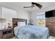 Well-lit bedroom featuring wood accents and a ceiling fan, complete with decor at 8612 Lunar Skye St, Sarasota, FL 34241