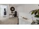 Hallway space featuring decor and access to an office space with desk and decor at 8612 Lunar Skye St, Sarasota, FL 34241