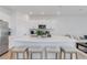 Stylish kitchen with a spacious island, white cabinets, and modern appliances at 8612 Lunar Skye St, Sarasota, FL 34241