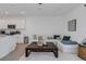 Open-concept living area with kitchen, and living room. Perfect for entertaining Gathering and friends at 8612 Lunar Skye St, Sarasota, FL 34241