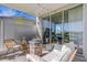 Relaxing patio features stylish seating, a brick fire pit, and pond views at 8612 Lunar Skye St, Sarasota, FL 34241