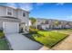 Street view of well-maintained homes with manicured lawns and sidewalks at 8612 Lunar Skye St, Sarasota, FL 34241