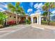 Exterior view of clubhouse featuring well-maintained landscaping and accessible parking at 10530 Boardwalk Loop # 502, Bradenton, FL 34202