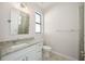Bathroom featuring a vanity sink with granite countertop and walk-in shower at 11165 Balfour St, Venice, FL 34293