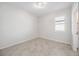 This bedroom features tiled flooring and a window for natural light at 11165 Balfour St, Venice, FL 34293