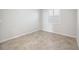 This bedroom features tiled flooring and a window for natural light at 11165 Balfour St, Venice, FL 34293